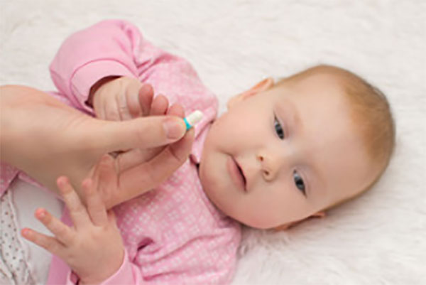 На фоне грудничка капсула